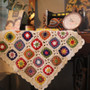 Handmade crochet daisy blanket in vibrant colors made from Acrylic Material with rustic grandmother style design.