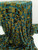 High-resolution shot of Olive Gold and Teal Geometric Stretch Velvet Burnout fabric draped on a professional studio display with a bright white background.
