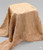 Textured crushed faux fur fabric in a warm camel tone, draped.