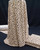 Ivory rayon challis fabric with black spotted print.