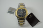 Patek Philippe 3900/1JA Nautilus stainless steel & 18k w/ papers c. 1995 modern pre owned for sale houston fabsuisse