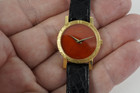Piaget Ladies Cocktail Watch 18k yellow gold factory coral dial dates 1970-80's all original pre owned for sale houston fabsuisse