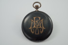 A fine antique Movado pocket watch in .900 silver, crafted circa 1910-20. A fantastic rare find of an early Movado pocket watch  featuring Niello flat black accented case with unidentified gold colored initials on case back, and its movement pristine for its age and usage. Will need cleaning, and possible servicing.

Modeled on size 6 inch wrist.

Case marked Movado with Swiss hallmarks.
Small dent at 6:00 position.
Balance wheel swings.
Original glass crystal, dial, hands and crown. 
Case measures 48.5 mm.
Movado cal., 15 jewels 4 adjustments.
Serial# 0623103