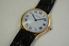 Cartier Round Paris 18k yellow gold mechanical wind dates 1990's modern pre owned for sale houston fabsuisse