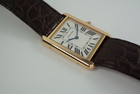 A very nice preowned Cartier Tank Solo reference 3167 in 18k rose gold , crafted during the mid 2000s.  An enduring classic with simple rectangular softly edged case housing a silvered dial and black Roman numeral hour markers with inconspicuous Cartier logo at 7 o’clock, inner black minute track and blued-steel sword-shaped hands and blue spinel beaded crown. Paired with the brown alligator strap, will suit a variety of settings, sitting comfortably on the wrist with its 5.5 mm silhouette.

Original polished case shows minimal wear,
Original dial, hands and Cartier crown.
Sapphire crystal.
Case measures 27.5 x 35mm, 5.5 mm thick.
Cartier quartz movement, 7 jewels.
Serial# 74211xxx
Cartier brown alligator strap (85% condition approximation).
Cartier 18k rose gold tang buckle.
20mm lug width.