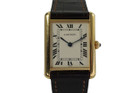 A preowned Cartier Tank Louis reference 1140-2 in 18k yellow gold, crafted during the 2000s. Polished 24mm rectangular case retains its original finish, houses a silvered white dial, black Roman numeral hours with hidden Cartier at 7 o’clock, black inner minute track, blued-steel sword-shaped hands and beaded cabochon crown. An enduring classic from Cartier, fitting for both men and women for a variety of outfits.
