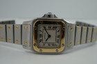 BRAND:                            Cartier 
MODEL:                            Santos Galbee
CASE MATERIAL:            Stainless steel/18k yellow gold
CASE MEASURES:          24 x 35 mm
MOVEMENT:                     Quartz
FUNCTIONS:                    Time
CONDITION:                     Fine
See it in our eBay store.
A classic Cartier Santos Galbee 1567 in stainless steel and 18k yellow gold, produced in the 1990s. Easy to wear for a sporty and casual look, elevated by its gold bezel and signature screws. Comfort fit with the double folding clasp mechanism and thin profile. Modeled on size 6 inch wrist. 

Light scratches.
Original dial, hands and crown. 
Case measures 24 x 35, 6mm thick.
Cartier quartz movement. 
Serial# 3807xxCD
Sapphire crystal.
Cartier bracelet fits 6 inches approximate.
14 mm between lugs.