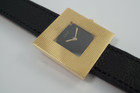 BRAND:                           Piaget
MODEL:                           Square
CASE MATERIAL:            18k yellow gold
CASE MEASURES:          28 mm
MOVEMENT:                     Mechanical winding
FUNCTIONS:                    Time
CONDITION:                     Fine
See it in our eBay store.

A fine rare vintage Piaget square reference 99014 in 18k yellow gold, crafted during the 1970s. At first glance, a minimal piece with its thin profile and black and gold configuration. More meets the eye, however, with the attractive hobnail bezel that softens the bold square frame, and harmoniously symmetrical in scale to the face. Suitable for casual and dressy occasions. Modeled on a 6 inch wrist. 

Light scratches, dial’s corners show underlying gold finish. 
Original black dial, hands and crown. 
Square face measures 14 mm.
Case measures 28 mm, 4.3 mm thick. 
Piaget cal. 9PZ, 18 jewels mechanical winding.
Serial# 2754xx Movement# 768476
Sapphire crystal.
Premium new non-Piaget black leather strap.
Piaget 18k gold buckle.
17 mm between lugs.