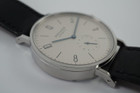 A fine preowned NOMOS Glashutte Tangomat in stainless steel, crafted circa 2008-10. A minimal and sturdy accessory of famed German craftmanship, featuring tonal silver dial with subsidiary dial, blue hands and black markers. The 38mm size circumvents overpowering the wrist while preserving a statement with its slightly bold profile and angular grasshopper-style lugs, with a glass exhibition to the beautiful movement. Modeled on 6 inch wrist.

Minimal wear.
Box and papers included.
Case measures 38 x 48 mm, 8.5 thick.
NOMOS cal., 26 jewel automatic winding. 
Serial# 2645
Sapphire crystal.
NOMOS black Shell Cordovan strap (75-80% condition approximate).
NOMOS steel buckle. 
USD retail approx. 3280 USD
20mm between lugs.