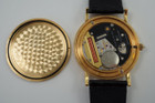 A fine Corum 20 Dollar Coin watch in 18k yellow gold, crafted during the 1990s. USA coin from 1897 exhibits little wear, with the classic ridged coin case and diamond crown. Durable for everyday wear, features a date aperture and black hands contrasting delightfully against the gold face, paired with a glossy alligator black strap.