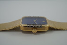 A fine vintage Rolex bracelet watch reference 4628 in 18k yellow gold, crafted circa 1985. A beautiful accessory featuring a gorgeous lapis dial with hints of pyrite peeking through radiates vividly in the light, and flanked by diamonds meticulously set on white gold seamlessly transfiguring into the yellow gold. Its 5.5mm rectangular profile provides an overall lightweight feel and the bracelet drapes the wrist comfortably. Suitable for all dress occasions. Modeled on 6 inch wrist.

Light scratches.
Original factory lapis dial, hands and crown.
Factory diamond set.
Case measures 23 x 25 mm, 5.5 mm thick. 
Rolex cal. 1601, 19 jewels mechanical winding.
Serial# 8833xxx Case# 793877
Sapphire crystal. 
Rolex bracelet fits 6 3/4 inches or 17.5cm, approximately.
15mm taper.
Weight 57.8 grams.