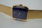 A fine vintage Rolex bracelet watch reference 4628 in 18k yellow gold, crafted circa 1985. A beautiful accessory featuring a gorgeous lapis dial with hints of pyrite peeking through radiates vividly in the light, and flanked by diamonds meticulously set on white gold seamlessly transfiguring into the yellow gold. Its 5.5mm rectangular profile provides an overall lightweight feel and the bracelet drapes the wrist comfortably. Suitable for all dress occasions. Modeled on 6 inch wrist.

Light scratches.
Original factory lapis dial, hands and crown.
Factory diamond set.
Case measures 23 x 25 mm, 5.5 mm thick. 
Rolex cal. 1601, 19 jewels mechanical winding.
Serial# 8833xxx Case# 793877
Sapphire crystal. 
Rolex bracelet fits 6 3/4 inches or 17.5cm, approximately.
15mm taper.
Weight 57.8 grams.