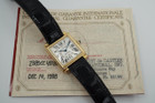 A fine preowned Cartier Tank Obus 2380 in 18k yellow gold, crafted circa 1998. The Obus is an iteration of the century-old Tank from Cartier, the name deriving from the French word “bullet” referencing the bullet-shaped lugs. The case sits prominently on the wrist without overwhelming the wearer, encompassing the silver guilloche dial, blued breguet hands black Roman numerals and blue sapphire cabochon crown. From the Collection Privée Cartier Paris line, the exhibition case back reveals the Cartier movement with special attention to interlocking C logo design making this an excellent piece for the collector’s repertoire. Modeled on 6 inch wrist.

Light tarnish.
Includes CPCP inner and outer box, and papers.
Original guilloche dial, blued breguet hands and Cartier crown. 
Case measures 26.5 x 33.5 mm, 8 mm thick. 
Cartier cal. 1585MC, 18 jewel mechanical.
Serial# CC451xxx Movement# 0843
Sapphire crystal. 
Cartier black crocodile strap (85% condition).
Cartier 18k yellow gold buckle. 
17 mm lug width.