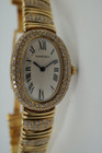 BRAND:                          Cartier
MODEL:                          Baignoire
CASE MATERIAL:           18k yellow gold and diamonds
CASE MEASURES:          22.5 x 30.5 mm
MOVEMENT:                   Quartz
FUNCTIONS:                   Time
CONDITION:                    Fine
See it in our eBay store.

A fine preowned Cartier Baignoire reference 3710 in 18k yellow gold, crafted during the 1980s. A current popular model with a distinctive added detail of the interchanging diamond settings and gold bracelet. Brilliant diamond set bezel and diamond crown encases an off white dial, blue steeled hands and black Roman numerals with hidden Cartier hallmark at 10 o’clock. The bracelet can be converted for a leather strap with ease for a more casual toned down look. Will certainly draw attention to the wearer’s wrist, wearing comfortably with either alternative.  

Light scratches on crystal. 
Original dial, hands and sapphire crown. 
Factory diamond set bezel and bracelet.
Case measures 22.5 x 30.5 mm, 6.5 mm thick. 
Acrylic crystal. 
Cartier quartz movement. 
Serial# 8057xxx
Cartier diamond bracelet fits 5 7/8 inches or 14.5 cm, approximately. Can be sized down.
New non-Cartier black leather strap.
13 lug width.
Modeled on 6 inch wrist.