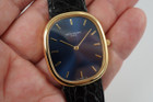 A fine preowned Patek Philippe Golden Ellipse in 18k yellow gold, crafted during the 2000s. A popular model from Patek for its perfectly proportionately oval case encasing a blue sunburst dial that glistens in the light beautifully with the shiny gold hour markers and hands. Paired with a black alligator strap for a casual and comfortable feel, with buckle that replicates the oval motif. 

Minimal scratches. 
Original blue sunburst dial, gold markers/hands and Patek crown. 
Case measures 31 x 36 mm, 6mm thick. 
Patek cal. 240, automatic winding.
Sapphire crystal. 
Patek Philippe black alligator strap (80% condition). 
Patek Ellipse 18k buckle 
20mm lug width. 
Modeled on 6 inch wrist.