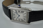 A fine preowned Cartier Tank Solo reference 2716 in stainless steel, crafted circa 2015. A casual everyday accessory, with the 6mm profile case encasing a white Roman dial, black Roman numeral hours with hidden Cartier hallmark at 10 o’clock, and blued steel hands. Paired with a black crocodile strap and blue sapphire cabochon crown, this classic configuration of the popular Tank will serve a variety of occasions. 

Minimal scratches. 
Original dial, hands and crown
Case measures 24 x 31 mm, 6mm thick. 
Cartier quartz movement. 
Sapphire crystal. 
Cartier adjustable black crocodile strap (90% condition), fits 6 3/4 inches.
Cartier steel deployment. 
17mm lug width. 
Modeled on 6 inch wrist.