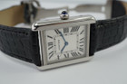 A fine preowned Cartier Tank Solo reference 2716 in stainless steel, crafted circa 2015. A casual everyday accessory, with the 6mm profile case encasing a white Roman dial, black Roman numeral hours with hidden Cartier hallmark at 10 o’clock, and blued steel hands. Paired with a black crocodile strap and blue sapphire cabochon crown, this classic configuration of the popular Tank will serve a variety of occasions. 

Minimal scratches. 
Original dial, hands and crown
Case measures 24 x 31 mm, 6mm thick. 
Cartier quartz movement. 
Sapphire crystal. 
Cartier adjustable black crocodile strap (90% condition), fits 6 3/4 inches.
Cartier steel deployment. 
17mm lug width. 
Modeled on 6 inch wrist.