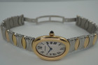 A fine preowned Cartier Baignoire reference W15045D8 in 18 yellow gold and stainless steel, crafted during the 2000s. A wonderful design with an attractive smooth oval case, featuring the classic off-white dial, black Roman numerals, blued steel hands, and blue sapphire crown. This versatile piece can be comfortably worn with its steel and gold Casque D'Or bracelet with hidden clasp, or alternatively with a black leather strap adopting a more casual feel. 

Minimal scratches. 
Original dial, hands and crown.
Case measures 22.5 x 31 mm, 7mm thick. 
Carter quartz movement. 
Serial# 8057xxx-42xx
Acrylic crystal, light scratches.
Cartier gold and steel bracelet, fits 6 3/4 inches or 17.3cm approximately.
13mm lug width.