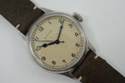 A fine Longines Heritage Military reference L2.819.4.93.2 in stainless steel. A 1940’s reissue of Longines’ enduring association to the realm of aviation brought this model, current in today’s catalogue of the Longines Heritage collection with US. Retail of $2425. Longines describes this dial color as silver, although it appears to be more beige with faint splattering of dots, bearing a patina-like impression of its vintage predecessor. The painted Arabic numerals and railroad ring for the minutes, typical of military pieces of its time. Wears handsomely on the wrist, and may be rotated with a Velle Alexander custom strap or military green nato-style strap, apropos to its theme.  

Original dial, blued steel hands and crown.
Case measures 38.5 x 47.6 mm, 11.70mm thick. 
Longines automatic movement.
Serial# 498242xx
Sapphire crystal.
New generic green 19mm Nato-style strap.
Extra long Velle Alexander custom strap, like new.
Longines 18mm steel signed buckle.
19mm lug width.