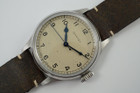 A fine Longines Heritage Military reference L2.819.4.93.2 in stainless steel. A 1940’s reissue of Longines’ enduring association to the realm of aviation brought this model, current in today’s catalogue of the Longines Heritage collection with US. Retail of $2425. Longines describes this dial color as silver, although it appears to be more beige with faint splattering of dots, bearing a patina-like impression of its vintage predecessor. The painted Arabic numerals and railroad ring for the minutes, typical of military pieces of its time. Wears handsomely on the wrist, and may be rotated with a Velle Alexander custom strap or military green nato-style strap, apropos to its theme.  

Original dial, blued steel hands and crown.
Case measures 38.5 x 47.6 mm, 11.70mm thick. 
Longines automatic movement.
Serial# 498242xx
Sapphire crystal.
New generic green 19mm Nato-style strap.
Extra long Velle Alexander custom strap, like new.
Longines 18mm steel signed buckle.
19mm lug width.