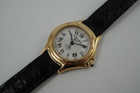 A very nice Cartier Panthere Cougar reference 1171-1 in 18k yellow gold, crafted in 1997. A special limited edition accessory commemorating 150 years of its inception in 1847, featuring a special dial with L heart C inside an inverted diamond, red numerals on sweep seconds, blued steel hands, glossy black Roman hour numerals, sapphire cabochon and date aperture at 3 o’clock position. Despite its diminutive 23mm case, the dial will garner a double take and wears quite comfortably on the wrist with its low profile.

Light scratches on case.
Original commemorative 1847 150th anniversary dial, blued steel hands and sapphire cabochon crown. 
Case measures 26 x 31mm, 6.5mm thick.
Cartier quartz movement. 
Serial# C283xx 
Sapphire crystal.
Cartier black crocodile strap (85% condition, approximate).
Cartier 18k yellow gold buckle. 
12mm lug width.
Modeled on 6 inch wrist.