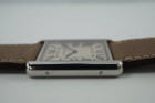 A very nice preowned Cartier Tank Solo reference 3169 in stainless steel, crafted circa 2015. Iterations currently offered in Cartier’s line of offerings, features the standard silvered grained dial with black Roman numerals and chemin de fer, blued steel sword shape hands, and blue spinel cabochon. Can be worn with its steel bracelet for everyday wear, or alternate for the taupe leather strap for a more casual feel. Suitable for men or women.

Minimal scratches.
Original dial, hands and crown. 
Case measures 27.5 x 34.5mm, 5.5mm thick.
Cartier quartz movement.
Sapphire crystal.
Serial# 9110xxxX
Cartier steel bracelet, measures 6 1/4 inches.
Premium non-Cartier taupe leather strap.
20 mm lug width. 
Modeled on a 6 inch wrist.