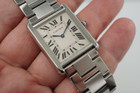 A very nice preowned Cartier Tank Solo reference 3169 in stainless steel, crafted circa 2015. Iterations currently offered in Cartier’s line of offerings, features the standard silvered grained dial with black Roman numerals and chemin de fer, blued steel sword shape hands, and blue spinel cabochon. Can be worn with its steel bracelet for everyday wear, or alternate for the taupe leather strap for a more casual feel. Suitable for men or women.

Minimal scratches.
Original dial, hands and crown. 
Case measures 27.5 x 34.5mm, 5.5mm thick.
Cartier quartz movement.
Sapphire crystal.
Serial# 9110xxxX
Cartier steel bracelet, measures 6 1/4 inches.
Premium non-Cartier taupe leather strap.
20 mm lug width. 
Modeled on a 6 inch wrist.