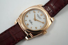 A fine vintage Rolex Cellini Cestello reference 5310 in 18k rose gold, crafted circa 1999. Dainty from its polished cushion-shaped 26mm case and slim 6mm silhouette with flexible lugs, smooth bezel housing a white dial, small rose gold Arabic/ tear drop hour markers, and sword-shaped hands. Paired with burgundy crocodile strap complimenting the rose gold. 

Minimal scratches.
Original dial, hands and crown. 
Case measures 26 x 32mm, 6mm thick.
Rolex cal. 1602, 20 jewels mechanical winding.
Sapphire crystal.
Serial# A8412xx
Rolex burgundy crocodile strap (80% condition approximation).
Rolex 18k rose gold buckle.
Modeled on a 6 inch wrist.