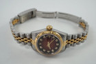 A fine preowned Rolex Datejust reference 79173 in stainless steel and 18k yellow gold, crafted circa 2001. This special 26mm watch houses a factory red vignette dial with diamond hour markers and gold applied hands, and date aperture. The vivid dial paired with the fluted gold bezel and two-tone jubilee bracelet create a distinct look on the wrist. 

Minimal scratches.
Rolex inner and outer box.
Original red vignette factory diamond dial, hands and crown. 
Case measures 26 x 33mm, 11mm thick.
Rolex cal. 2235, 31 jewels automatic winding.
Sapphire crystal.
Serial# Y785xxx
Rolex stainless steel & 18k gold jubilee bracelet, fits 6 1/2 inches. 
Modeled on a 6 inch wrist.