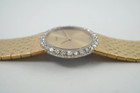 A fine vintage Piaget diamond bracelet watch in 18k yellow gold, crafted during the 1970s. The 25mm round and 5mm silhouette case houses 30 diamonds factory set bezel, approximately 1.20 carats, gold dial and dauphine hands. A beautiful accessory worn elegantly on the wrist for casual or formal wear.

Light scratch on crystal, 7 o’clock position.
Original dial, hands and crown. 
Case measures 25 x 25 mm, 5mm thick.
Piaget cal. 9P, 18 jewels mechanical winding. 
Sapphire crystal.
Serial# 151477 Movement# 6896xx
Piaget bracelet fits 6 1/4 inches or 16 cm approximate, links are removable.
16mm wide bracelet, tapers.
Modeled on a 6 inch wrist.