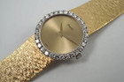 A fine vintage Piaget diamond bracelet watch in 18k yellow gold, crafted during the 1970s. The 25mm round and 5mm silhouette case houses 30 diamonds factory set bezel, approximately 1.20 carats, gold dial and dauphine hands. A beautiful accessory worn elegantly on the wrist for casual or formal wear.

Light scratch on crystal, 7 o’clock position.
Original dial, hands and crown. 
Case measures 25 x 25 mm, 5mm thick.
Piaget cal. 9P, 18 jewels mechanical winding. 
Sapphire crystal.
Serial# 151477 Movement# 6896xx
Piaget bracelet fits 6 1/4 inches or 16 cm approximate, links are removable.
16mm wide bracelet, tapers.
Modeled on a 6 inch wrist.