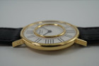 A very cool preowned Chopard watch in 18k yellow gold, crafted during the 1970s. A design that we have yet to come across, with an inner gold bezel surrounded by black hour markers we cannot distinguish what they represent. The 12, 3, 6, and 9 o'clock contain four hash marks while the rest contain two. Classic white dial and black hour markers and hands, yet distinctive from the standard in a 34mm round case and slim 6 mm silhouette would suit a variety of wrists and wardrobes. 

Original dial, hands and L.U.C. crown. 
Case measures 34 x 38 mm, 6mm thick.
Chopard L.U.C. cal. P7001, 17 jewels manual wind.
Sapphire crystal.
Serial# 146442-1048
New non-Chopard black leather strap.
17mm lug width.