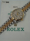 A very nice preowned Rolex Datejust reference 68273 in 18k yellow gold and stainless steel, crafted circa 1998. Papers accompany this piece, from Australian retailer “J. Farren-Price”, dated 9 Jan 1998 and full hologram on case back remains preserved. The 31mm round case and 11mm thick profile with gold fluted bezel, houses ivory anniversary dial, gold applied Arabic hours and faceted baton hands, and date aperture. A great accessory for casual occasions.