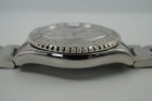 A preowned Rolex Yachtmaster reference 16622 in stainless steel, crafted in 2003. The 41 mm case features a platinum insert 60-minute graduations bidirectional rotating bezel and platinum dial with large luminescent dot, baton and triangle hour markers and hands, red seconds hand, and outer black minute track. Houses an automatic movement, steel Oyster bracelet with flip-lock clasp, and is accompanied by its punched papers dated 4/2003. A handsome sports accessory accented for all casual occasions.