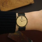 A wickedly cool Jaeger-LeCoultre from the 1980s that appears minimal at first glance, but reveals considerably more detail on closer inspection. The ultra-thin 18k yellow gold case has an unusual sculpted form, with gently concave sides flowing into long, tapered lugs. A fine black enamel accent circles the bezel, giving the warm gold case a sharp line of contrast.
The beautifully textured champagne dial with a soft, frosted appearance follows the same minimalist approach, interrupted only by a singular elongated black Roman numeral at 12 o’clock. Slim pointed gold hands appear almost suspended over the dial, meeting at a clean circular center without the usual visible central hardware. It is an exceptionally simple layout, but far from ordinary.
Powered by the Jaeger-LeCoultre caliber 895 manual-wind movement and finished with a JLC-signed crown. Fitted with a black JLC crocodile strap and JLC gold-plated buckle. A neo-vintage JLC with considerably more going on than first meets the eye.


Case Number: 9211-21
Serial Number: 1520xxx
Case: 18k yellow gold with black enamel bezel accent
Case Size: 30 × 35 mm; 5 mm thick
Dial: Textured champagne with elongated black Roman numeral at 12 o’clock
Movement: Jaeger-LeCoultre caliber 895, manual wind
Strap: JLC black crocodile
Buckle: JLC gold-plated buckle
Lug Width: 18 mm
Wrist Size: Fits up to approximately 7 inches
Modelled On: 6-inch wrist
Condition: Light wear shown
Service: Timing performed by our watchmaker