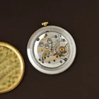 A wickedly cool Jaeger-LeCoultre from the 1980s that appears minimal at first glance, but reveals considerably more detail on closer inspection. The ultra-thin 18k yellow gold case has an unusual sculpted form, with gently concave sides flowing into long, tapered lugs. A fine black enamel accent circles the bezel, giving the warm gold case a sharp line of contrast.
The beautifully textured champagne dial with a soft, frosted appearance follows the same minimalist approach, interrupted only by a singular elongated black Roman numeral at 12 o’clock. Slim pointed gold hands appear almost suspended over the dial, meeting at a clean circular center without the usual visible central hardware. It is an exceptionally simple layout, but far from ordinary.
Powered by the Jaeger-LeCoultre caliber 895 manual-wind movement and finished with a JLC-signed crown. Fitted with a black JLC crocodile strap and JLC gold-plated buckle. A neo-vintage JLC with considerably more going on than first meets the eye.


Case Number: 9211-21
Serial Number: 1520xxx
Case: 18k yellow gold with black enamel bezel accent
Case Size: 30 × 35 mm; 5 mm thick
Dial: Textured champagne with elongated black Roman numeral at 12 o’clock
Movement: Jaeger-LeCoultre caliber 895, manual wind
Strap: JLC black crocodile
Buckle: JLC gold-plated buckle
Lug Width: 18 mm
Wrist Size: Fits up to approximately 7 inches
Modelled On: 6-inch wrist
Condition: Light wear shown
Service: Timing performed by our watchmaker