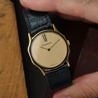 A wickedly cool Jaeger-LeCoultre from the 1980s that appears minimal at first glance, but reveals considerably more detail on closer inspection. The ultra-thin 18k yellow gold case has an unusual sculpted form, with gently concave sides flowing into long, tapered lugs. A fine black enamel accent circles the bezel, giving the warm gold case a sharp line of contrast.
The beautifully textured champagne dial with a soft, frosted appearance follows the same minimalist approach, interrupted only by a singular elongated black Roman numeral at 12 o’clock. Slim pointed gold hands appear almost suspended over the dial, meeting at a clean circular center without the usual visible central hardware. It is an exceptionally simple layout, but far from ordinary.
Powered by the Jaeger-LeCoultre caliber 895 manual-wind movement and finished with a JLC-signed crown. Fitted with a black JLC crocodile strap and JLC gold-plated buckle. A neo-vintage JLC with considerably more going on than first meets the eye.


Case Number: 9211-21
Serial Number: 1520xxx
Case: 18k yellow gold with black enamel bezel accent
Case Size: 30 × 35 mm; 5 mm thick
Dial: Textured champagne with elongated black Roman numeral at 12 o’clock
Movement: Jaeger-LeCoultre caliber 895, manual wind
Strap: JLC black crocodile
Buckle: JLC gold-plated buckle
Lug Width: 18 mm
Wrist Size: Fits up to approximately 7 inches
Modelled On: 6-inch wrist
Condition: Light wear shown
Service: Timing performed by our watchmaker