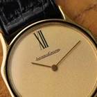 A wickedly cool Jaeger-LeCoultre from the 1980s that appears minimal at first glance, but reveals considerably more detail on closer inspection. The ultra-thin 18k yellow gold case has an unusual sculpted form, with gently concave sides flowing into long, tapered lugs. A fine black enamel accent circles the bezel, giving the warm gold case a sharp line of contrast.
The beautifully textured champagne dial with a soft, frosted appearance follows the same minimalist approach, interrupted only by a singular elongated black Roman numeral at 12 o’clock. Slim pointed gold hands appear almost suspended over the dial, meeting at a clean circular center without the usual visible central hardware. It is an exceptionally simple layout, but far from ordinary.
Powered by the Jaeger-LeCoultre caliber 895 manual-wind movement and finished with a JLC-signed crown. Fitted with a black JLC crocodile strap and JLC gold-plated buckle. A neo-vintage JLC with considerably more going on than first meets the eye.


Case Number: 9211-21
Serial Number: 1520xxx
Case: 18k yellow gold with black enamel bezel accent
Case Size: 30 × 35 mm; 5 mm thick
Dial: Textured champagne with elongated black Roman numeral at 12 o’clock
Movement: Jaeger-LeCoultre caliber 895, manual wind
Strap: JLC black crocodile
Buckle: JLC gold-plated buckle
Lug Width: 18 mm
Wrist Size: Fits up to approximately 7 inches
Modelled On: 6-inch wrist
Condition: Light wear shown
Service: Timing performed by our watchmaker