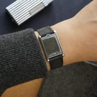A late 1990s Cartier Tank Basculante in stainless steel, wonderfully constructed in a compact 22mm size. The dark grey patterned dial is contrasted by bright white stylized Arabic numerals and silvered sword-shaped hands, giving the watch a distinctive monochromatic look.
The Basculante's hinged case is the highlight of the design, allowing the watch head to pivot within its frame and turn completely over. It opens and closes smoothly and can remain upright within the frame. A blue cabochon accents the case, while the crown is cleverly concealed and accessed only when the watch is flipped from its usual position.
Powered by a quartz movement and fitted with a custom dark grey Babele leather strap secured by a Cartier stainless steel deployant clasp. An unusual interpretation of the Tank, with much of its appeal found in the ingenious case construction.

Watch Details
Reference: 2386
Case Number: 3514xxxx
Case: Stainless steel
Case Size: 22 × 32 mm; 6 mm thick
Dial: Dark grey patterned dial; white Arabic numerals
Movement: Quartz
Crystal: Sapphire
Strap: Custom dark grey Babele leather, adjustable
Lug Width: 17 mm
Clasp: Cartier stainless steel deployant
Wrist Size: Fits up to approximately 6 1/2 inches
Modelled On: 6-inch wrist
Condition: Light wear shown
Service: New battery installed