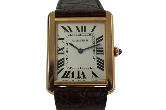 A very nice preowned Cartier Tank Solo reference 3167 in 18k rose gold , crafted during the mid 2000s.  An enduring classic with simple rectangular softly edged case housing a silvered dial and black Roman numeral hour markers with inconspicuous Cartier logo at 7 o’clock, inner black minute track and blued-steel sword-shaped hands and blue spinel beaded crown. Paired with the brown alligator strap, will suit a variety of settings, sitting comfortably on the wrist with its 5.5 mm silhouette.

Original polished case shows minimal wear,
Original dial, hands and Cartier crown.
Sapphire crystal.
Case measures 27.5 x 35mm, 5.5 mm thick.
Cartier quartz movement, 7 jewels.
Serial# 74211xxx
Cartier brown alligator strap (85% condition approximation).
Cartier 18k rose gold tang buckle.
20mm lug width.