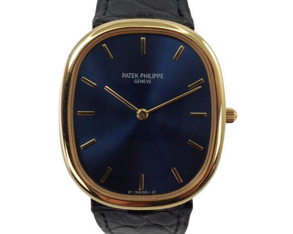 A fine preowned Patek Philippe Golden Ellipse in 18k yellow gold, crafted during the 2000s. A popular model from Patek for its perfectly proportionately oval case encasing a blue sunburst dial that glistens in the light beautifully with the shiny gold hour markers and hands. Paired with a black alligator strap for a casual and comfortable feel, with buckle that replicates the oval motif. 

Minimal scratches. 
Original blue sunburst dial, gold markers/hands and Patek crown. 
Case measures 31 x 36 mm, 6mm thick. 
Patek cal. 240, automatic winding.
Sapphire crystal. 
Patek Philippe black alligator strap (80% condition). 
Patek Ellipse 18k buckle 
20mm lug width. 
Modeled on 6 inch wrist.