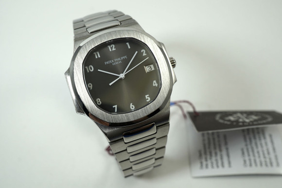 Patek Philippe 3900/1A Nautilus stainless steel recent service w/ tag c. 1990's for sale houston fabsuisse
