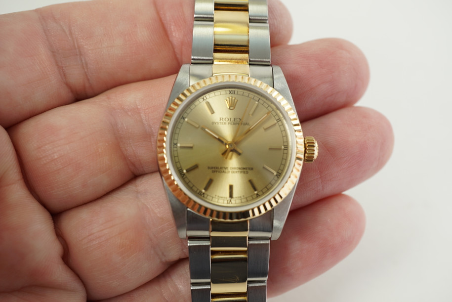 Rolex 67513 Oyster Perpetual stainless steel & 18k yellow gold 30 mm c. 1991 automatic pre owned for sale houston fabsuisse