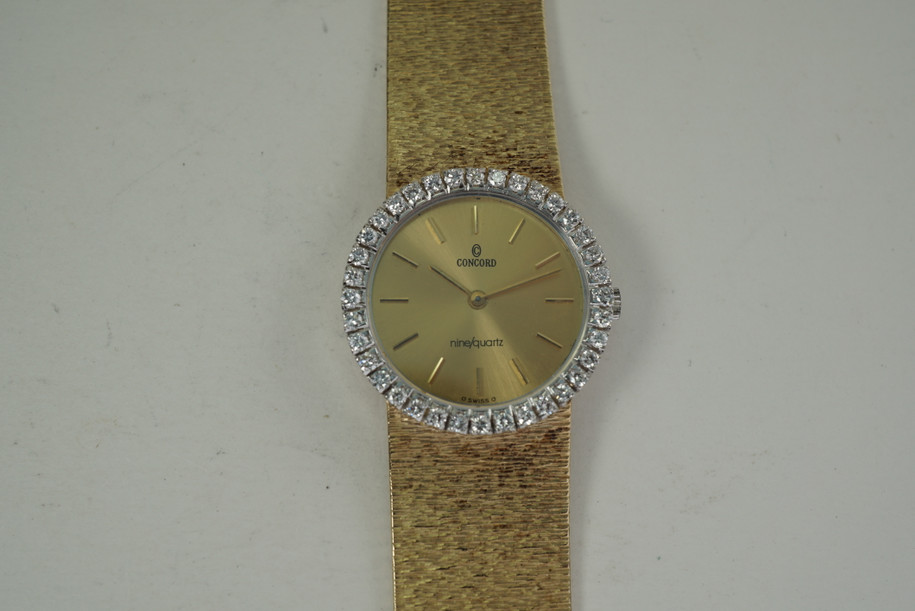 Concorde Ladies Nine Quartz factory diamond bezel dates 1990's 14k yellow gold pre owned for sale houston fabsuisse