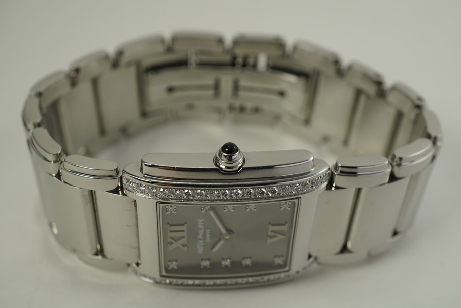 Patek Philippe 4910 Twenty 4 stainless steel w/ diamond bezel c. 2000's pre owned modern for sale houston fabsuisse