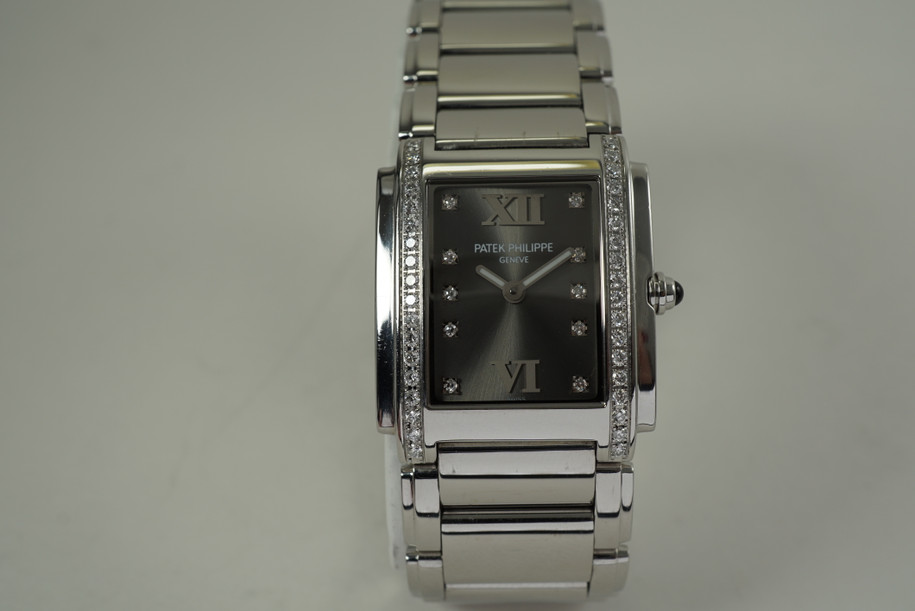 Patek Philippe 4910 Twenty 4 stainless steel w/ diamond bezel c. 2000's pre owned modern for sale houston fabsuisse