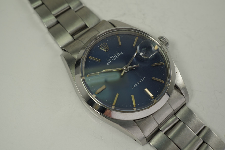 Rolex 6694 Oyster Date Precision Original blue dial 35 mm dates 1975 stainless steel vintage pre owned for sale houston fabsuisse