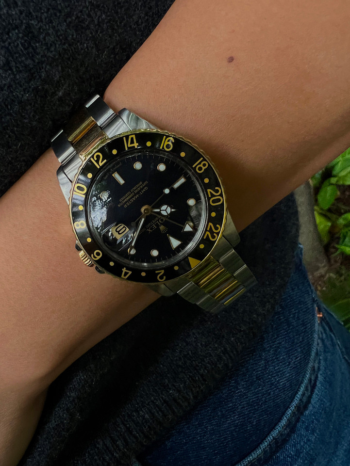 A fine preowned Rolex GMT in 18k yellow gold and stainless steel, produced circa 1980. This iconic model makes a sporty statement on the wrist with its thick case, black bezel and dial contrasting strikingly with the two-tone bracelet. Modeled on 6 inch wrist.

Original black dial Swiss-T <25, hands and gold Rolex crown.
Case measures 38 x 47 mm.
Rolex cal. 3075,  27 jewels quickset automatic movement. 
Serial# 6290xxx Movement# 04577xx
Acrylic crystal.
Rolex two-tone oyster bracelet.
Bracelet has #480 end pieces and stamped #78, 363, 18 J6.
Bracelet with five screws fits 7.5 inches approximate.
20mm between lugs.