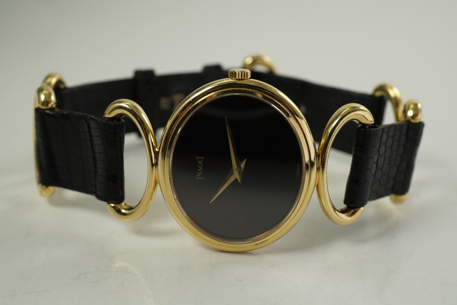 Piaget 9802 Ladies Wristwatch Onyx hoop & strap dates 1980's 18k yellow gold pre owned for sale houston fabsuisse