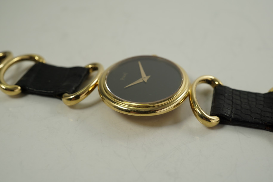 Piaget 9802 Ladies Wristwatch Onyx hoop & strap dates 1980's 18k yellow gold pre owned for sale houston fabsuisse